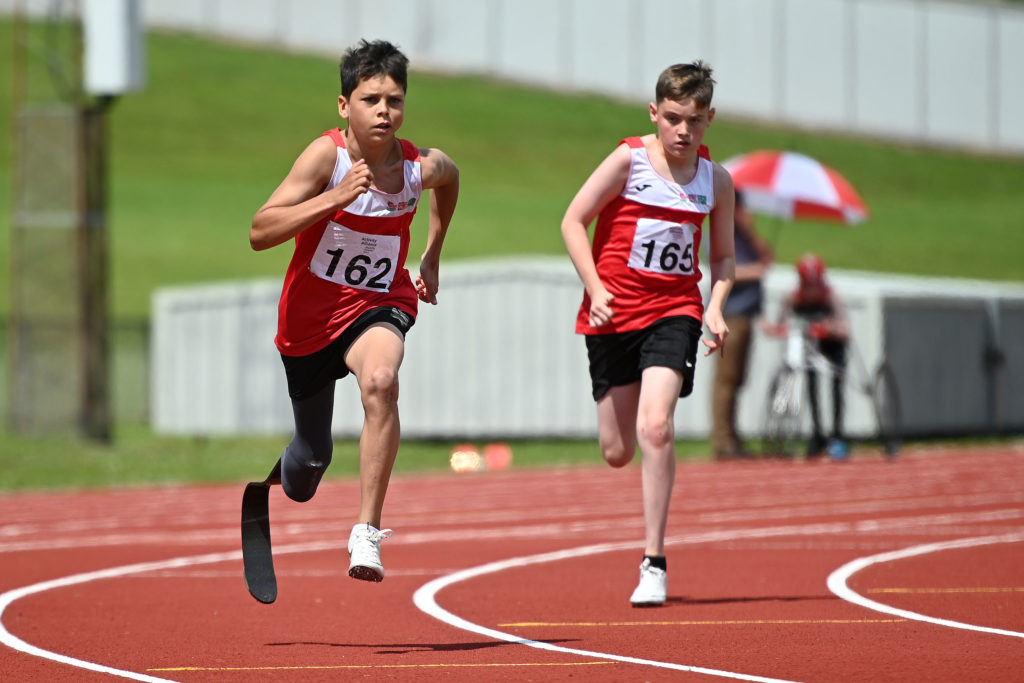 Two athletes competing at Activity Alliance's National Junior Athletics Championships